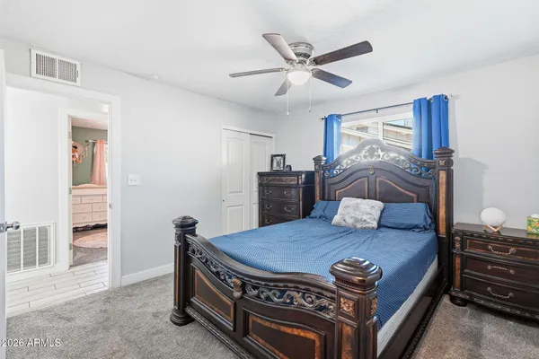 a bathroom with a double vanity sink and mirror