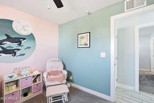 a view of a livingroom with furniture and a flat screen tv