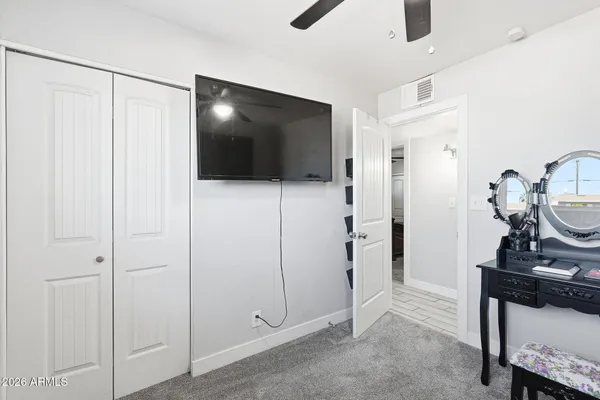 a view of a livingroom with furniture and a window