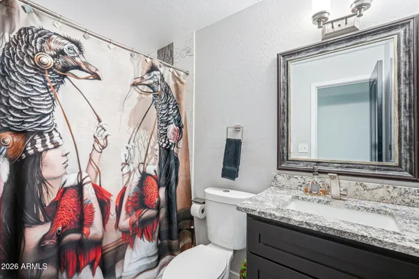 a view of a livingroom with furniture and a window