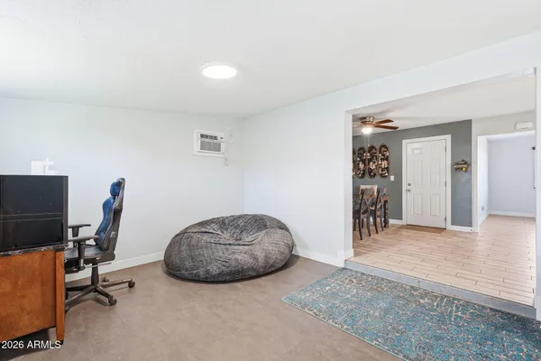a kitchen with granite countertop white cabinets and stainless steel appliances