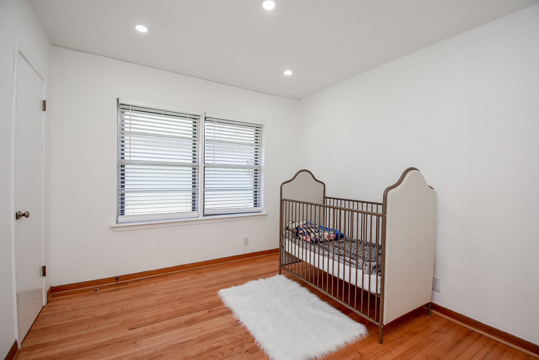 6817 Hendon Lane Houston, TX 77074 - Photo 23 of 30 a view of a room with wooden floor windows and a window
