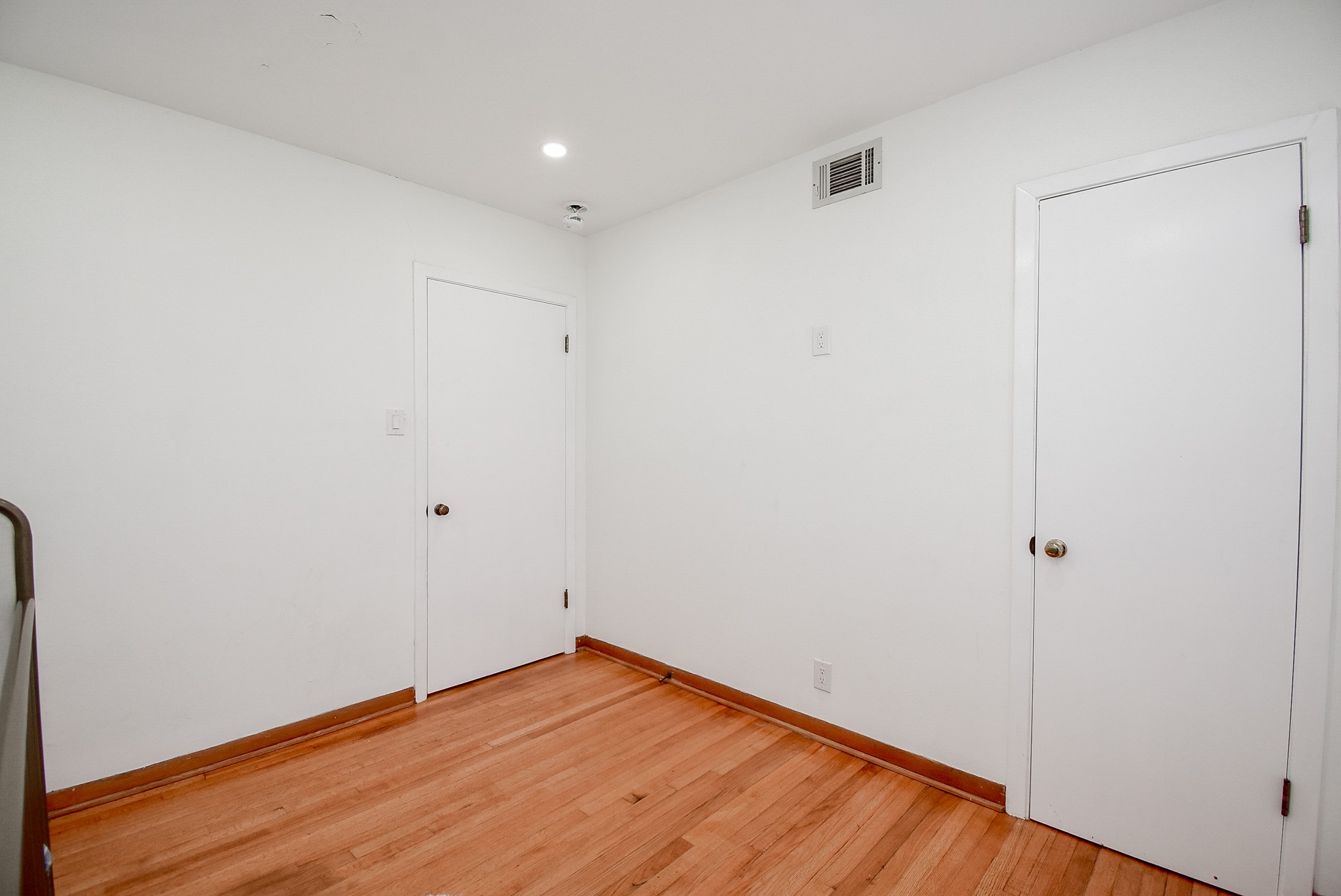 6817 Hendon Lane Houston, TX 77074 - Photo 24 of 30 a view of an empty room with wooden floor