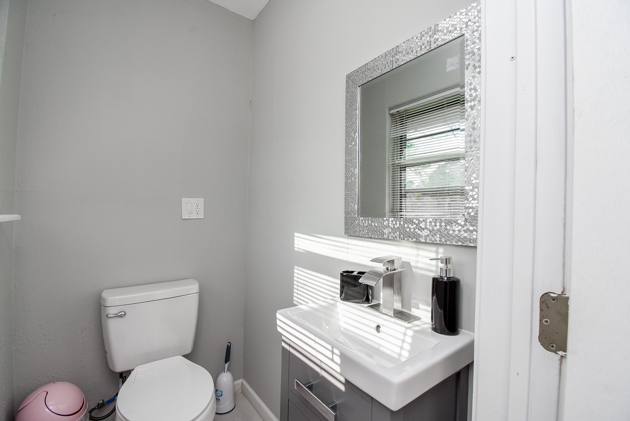 6817 Hendon Lane Houston, TX 77074 - Photo 26 of 30 a white toilet sitting next to a bathroom sink