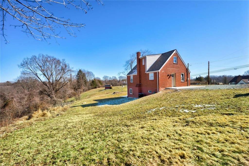 476 Peach Way Irwin, PA 15642 - Photo 4 of 25 a view of a house with a yard