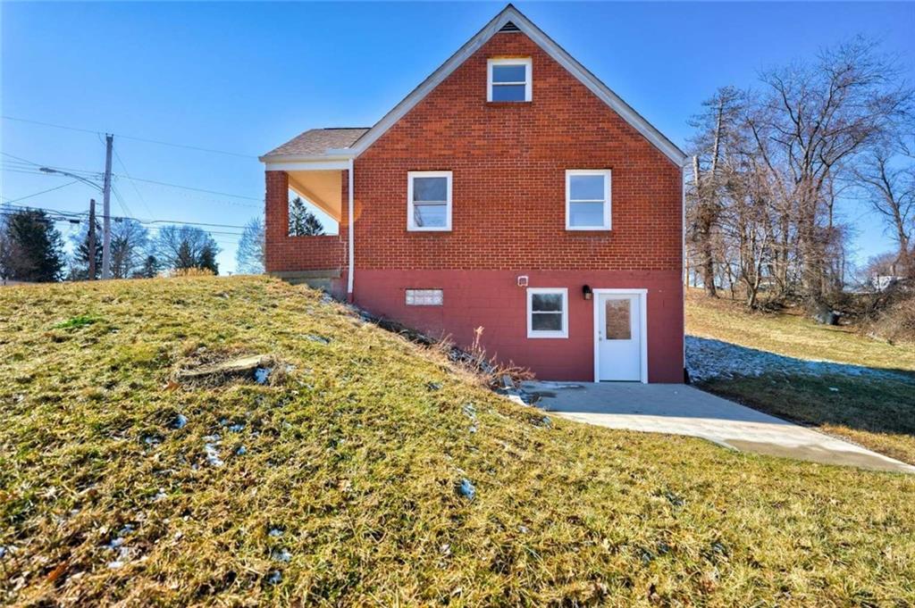 476 Peach Way Irwin, PA 15642 - Photo 5 of 25 a front view of a house with a yard