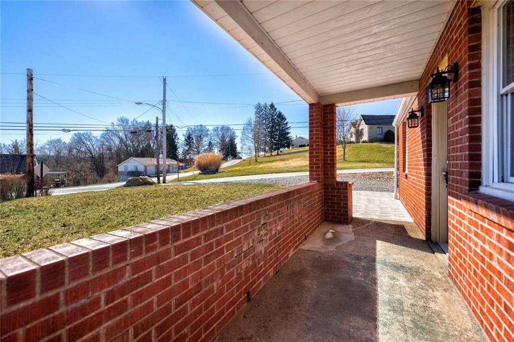 476 Peach Way Irwin, PA 15642 - Photo 7 of 25 a view of a porch with a yard
