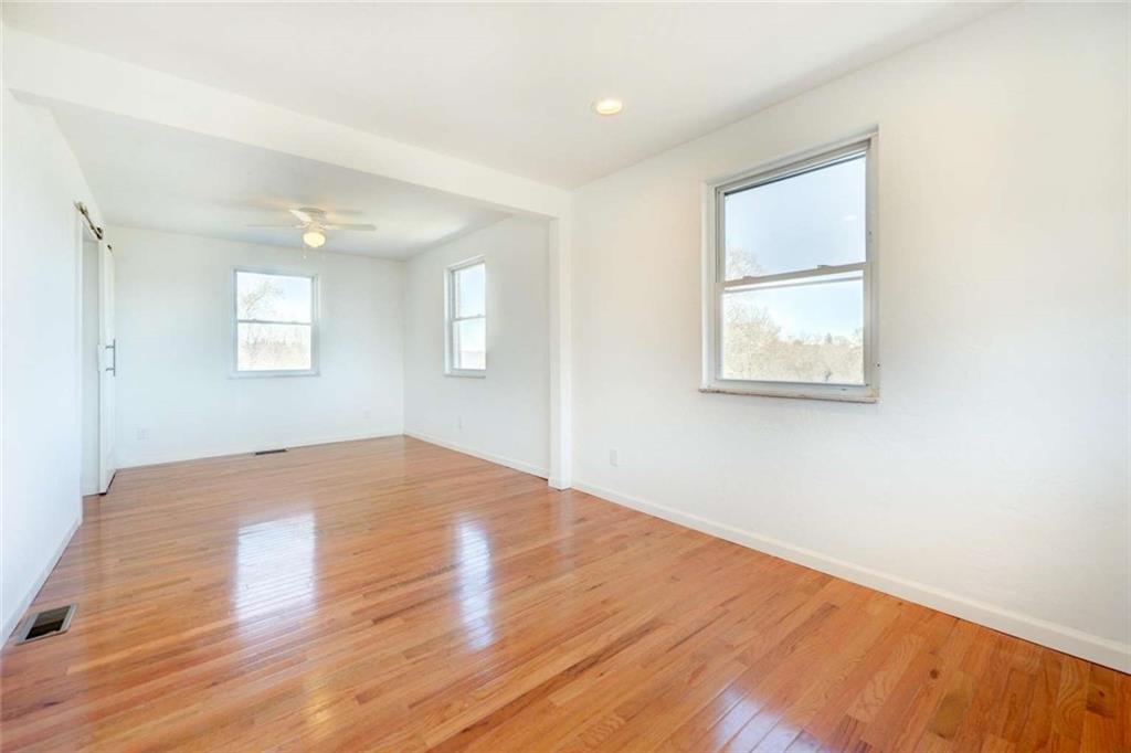 476 Peach Way Irwin, PA 15642 - Photo 8 of 25 a view of empty room with wooden floor