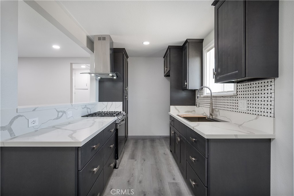 Quartz counter tops and modern design in kitchen.
