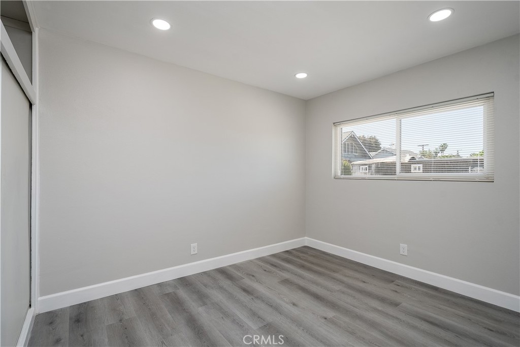 3630 Russell Street Riverside, CA 92501 - Photo 11 of 18 a view of empty room with wooden floor and fan