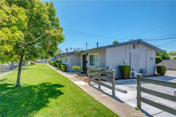 a view of a backyard with furniture