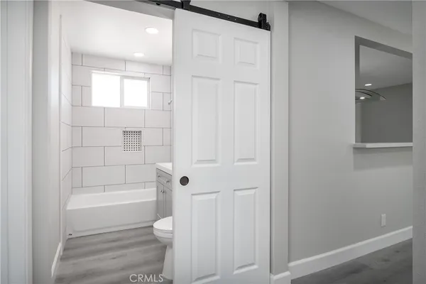 a bathroom with a shower and a toilet