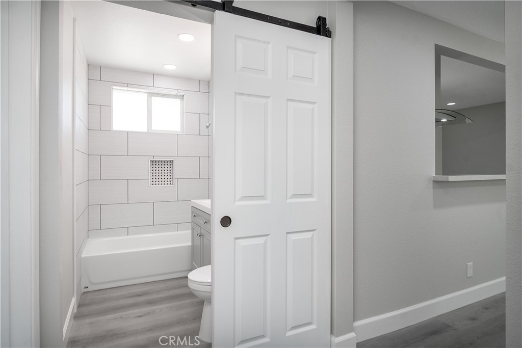 3630 Russell Street Riverside, CA 92501 - Photo 7 of 18 a bathroom with a shower and a toilet