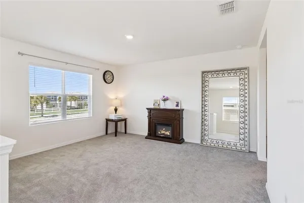 a view of livingroom with furniture and a fireplace