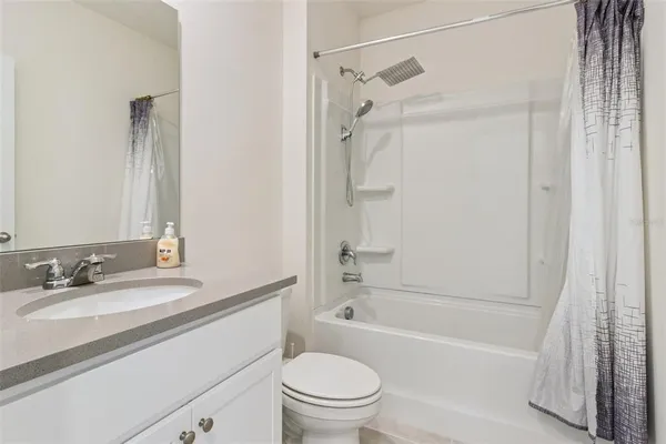 a bathroom with a sink a toilet and a bathtub