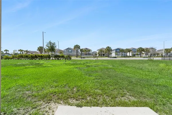 a view of a green field with clear sky