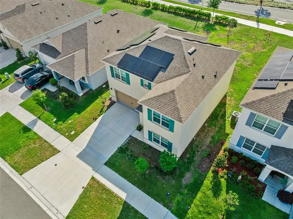 an aerial view of a house with a garden