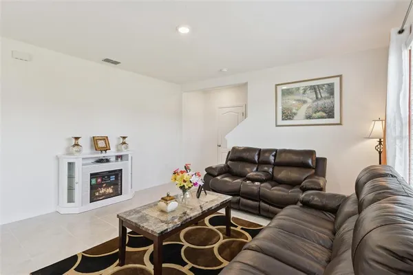 a living room with furniture and a couch