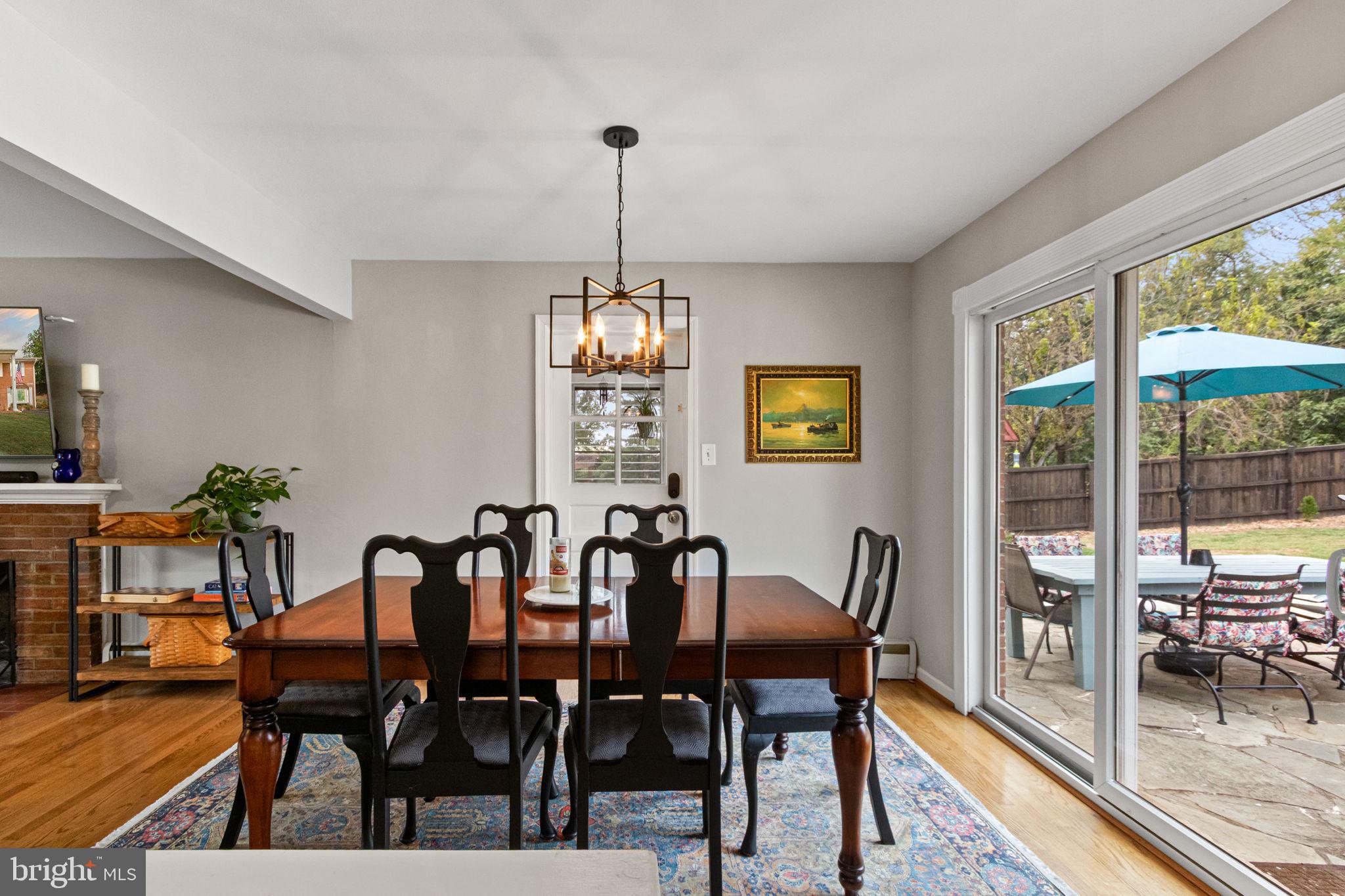 6700 Bulkley Road Lorton, VA 22079 - Photo 16 of 62 a view of a dining room with furniture window and wooden floor