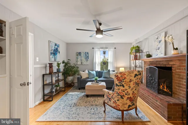 a living room with furniture and a piano