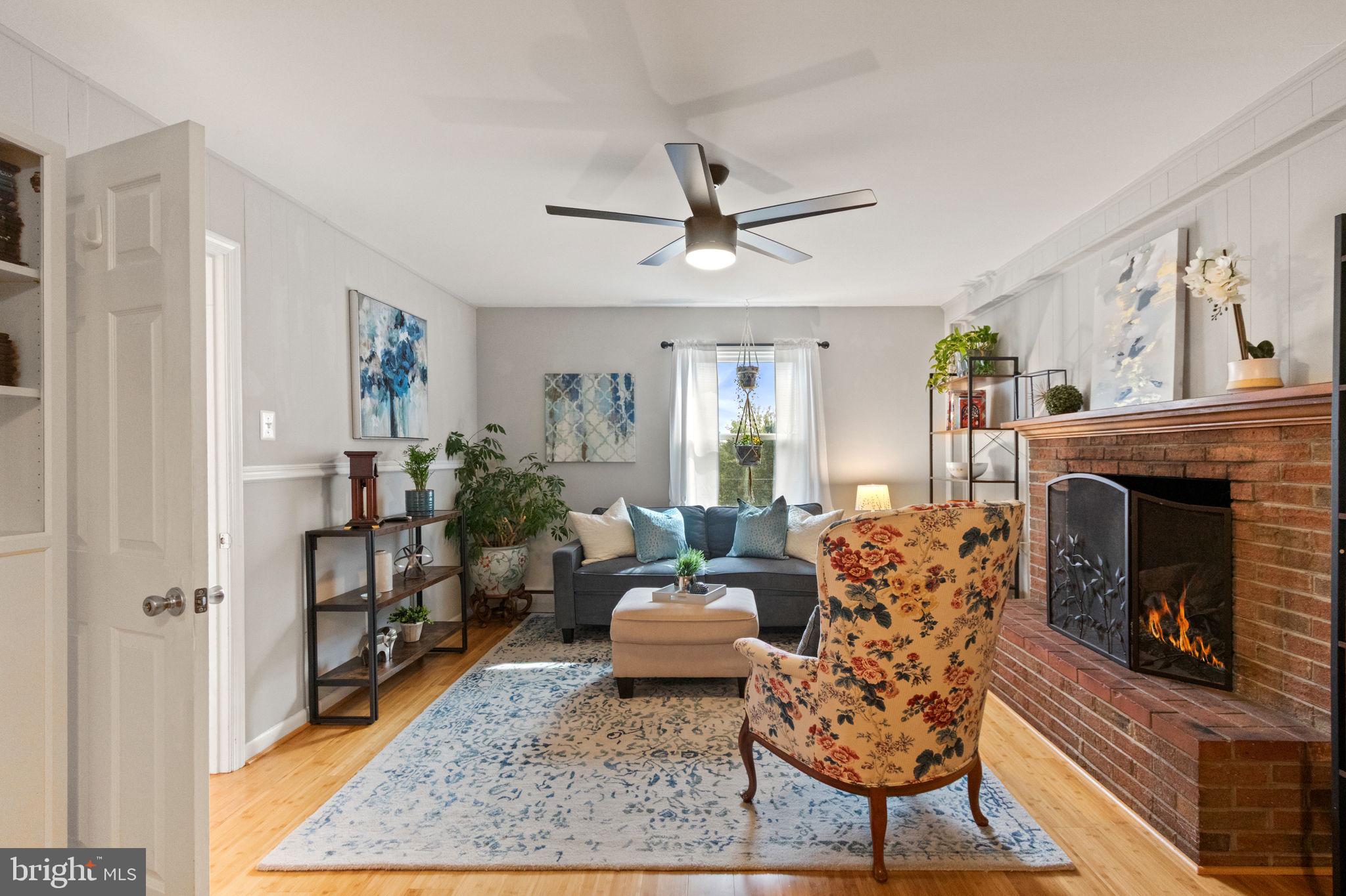 6700 Bulkley Road Lorton, VA 22079 - Photo 21 of 62 a living room with furniture and a fireplace
