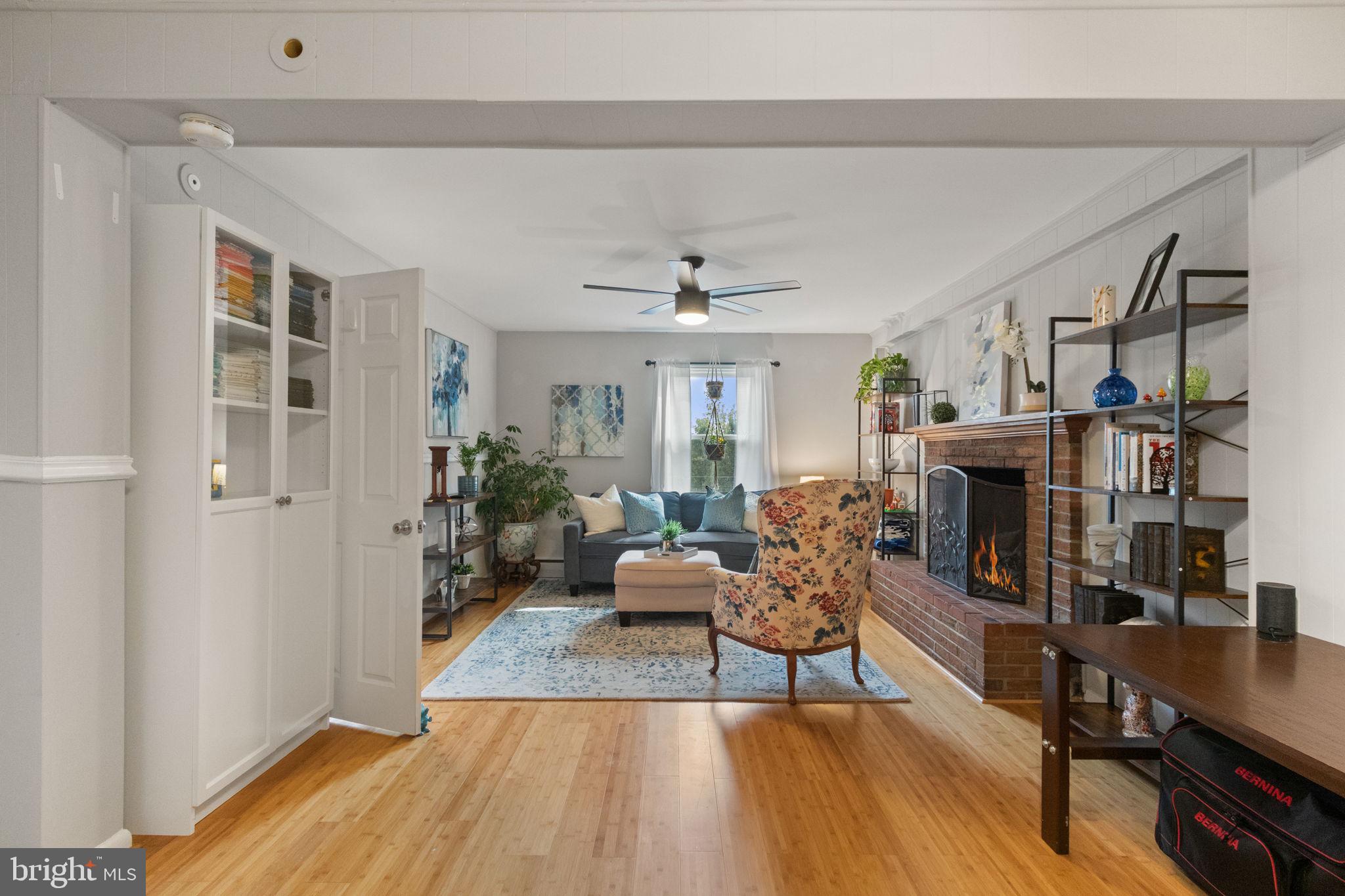 6700 Bulkley Road Lorton, VA 22079 - Photo 22 of 62 a living room with furniture and a wooden floor