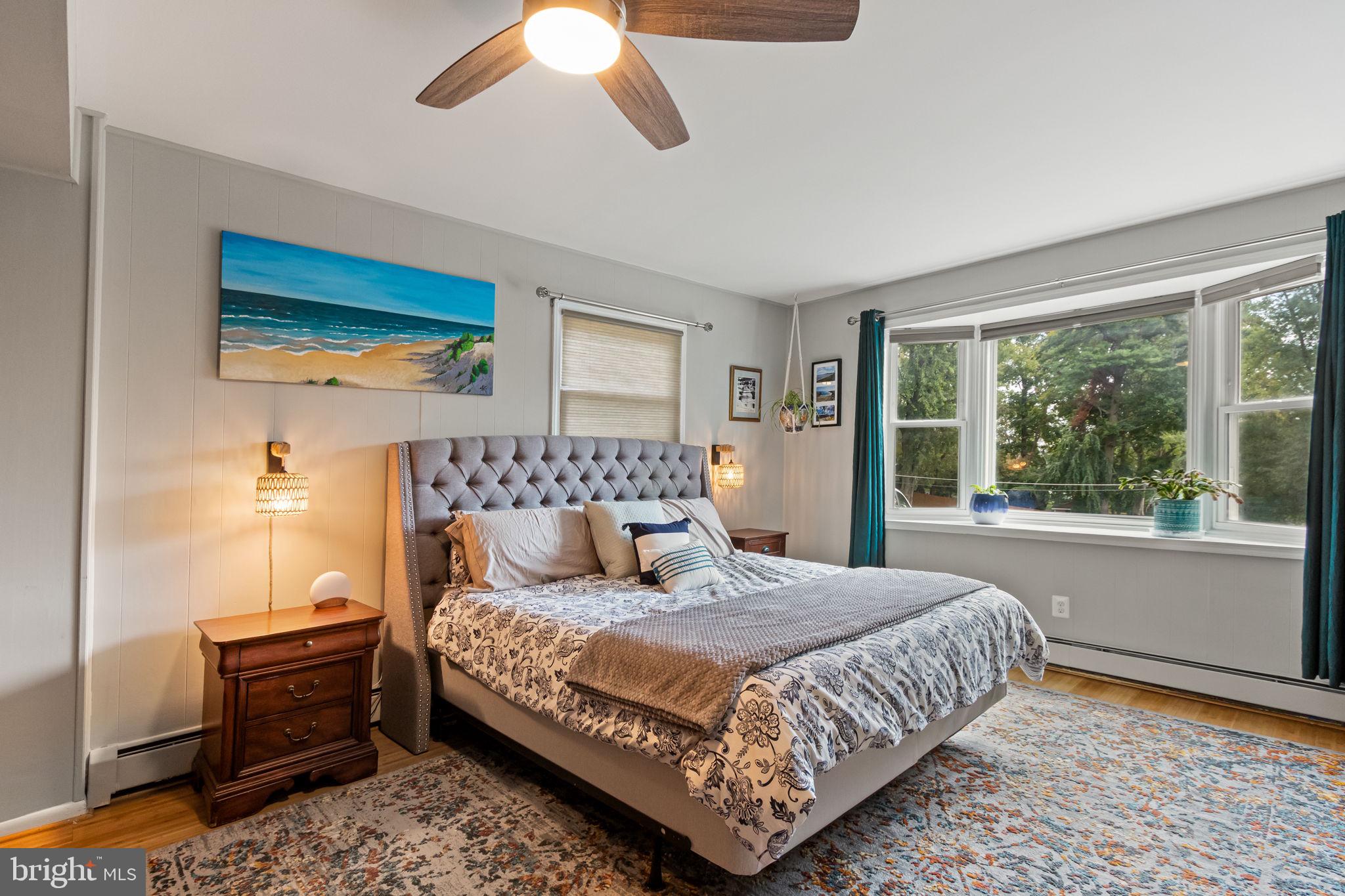 6700 Bulkley Road Lorton, VA 22079 - Photo 25 of 62 a bedroom with a large bed and a chandelier