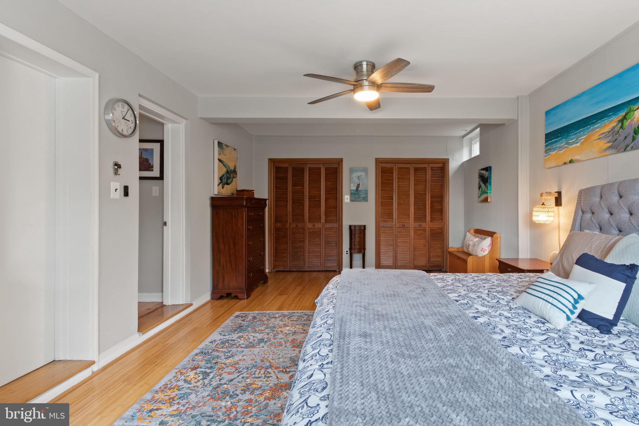 6700 Bulkley Road Lorton, VA 22079 - Photo 27 of 62 a bedroom with a large bed and a chandelier