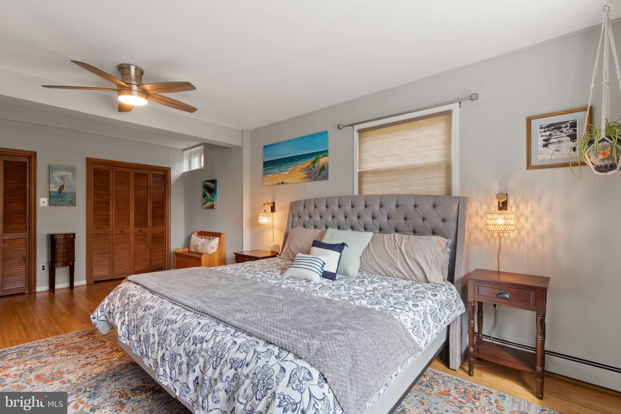 6700 Bulkley Road Lorton, VA 22079 - Photo 28 of 62 a bedroom with a bed and a lamp with window