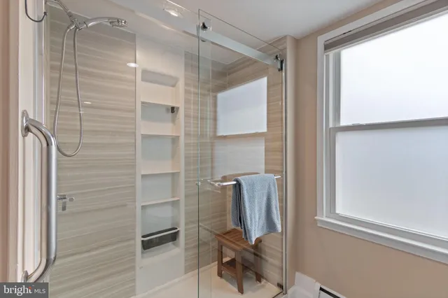 a front view of a house with dishwasher and a flat screen tv