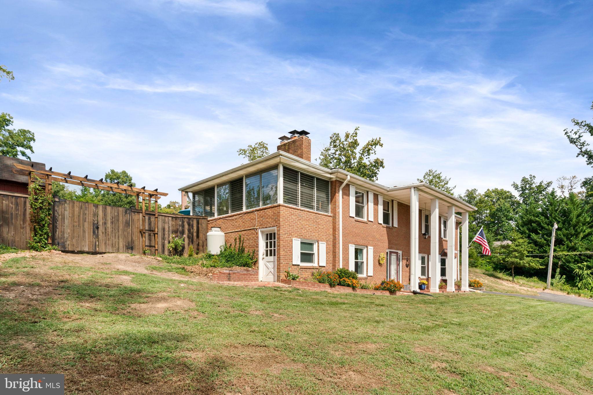 6700 Bulkley Road Lorton, VA 22079 - Photo 3 of 62 a front view of a house with a yard