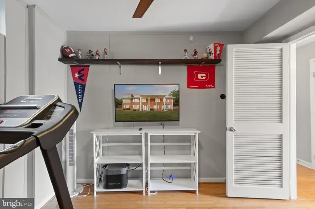 a view of a hallway with entryway wooden floor and front door