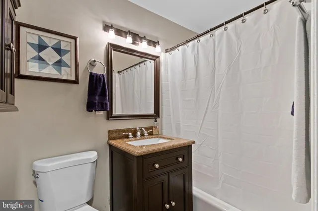 a view of a swimming pool with a yard and sitting space