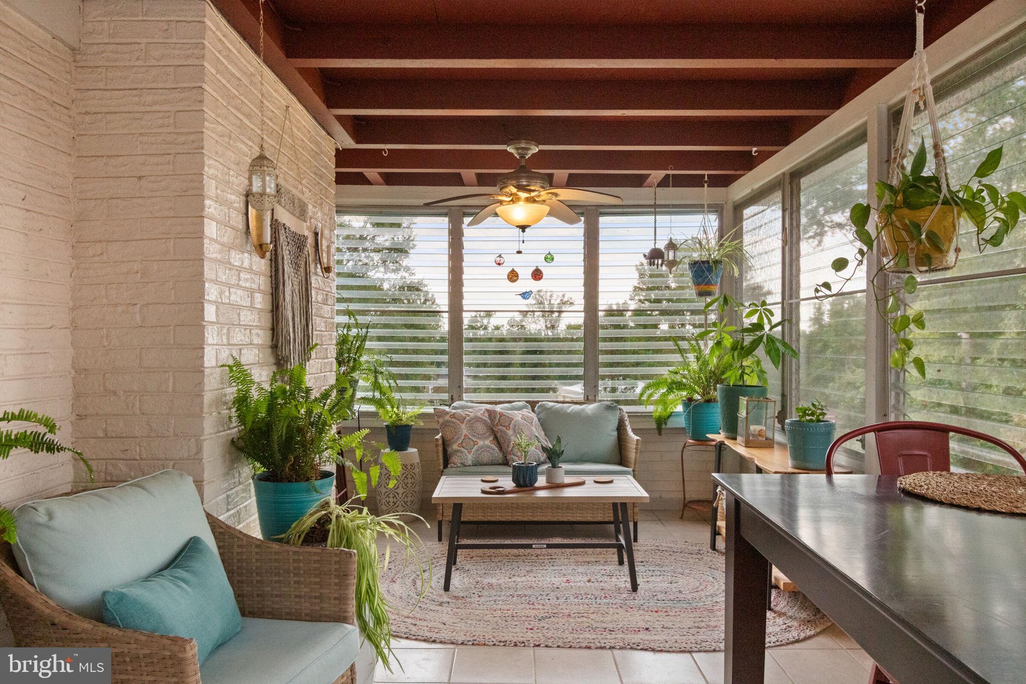 6700 Bulkley Road Lorton, VA 22079 - Photo 48 of 62 a balcony with furniture and a potted plant