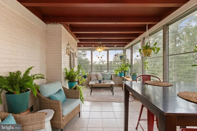 a view of a backyard with sitting area