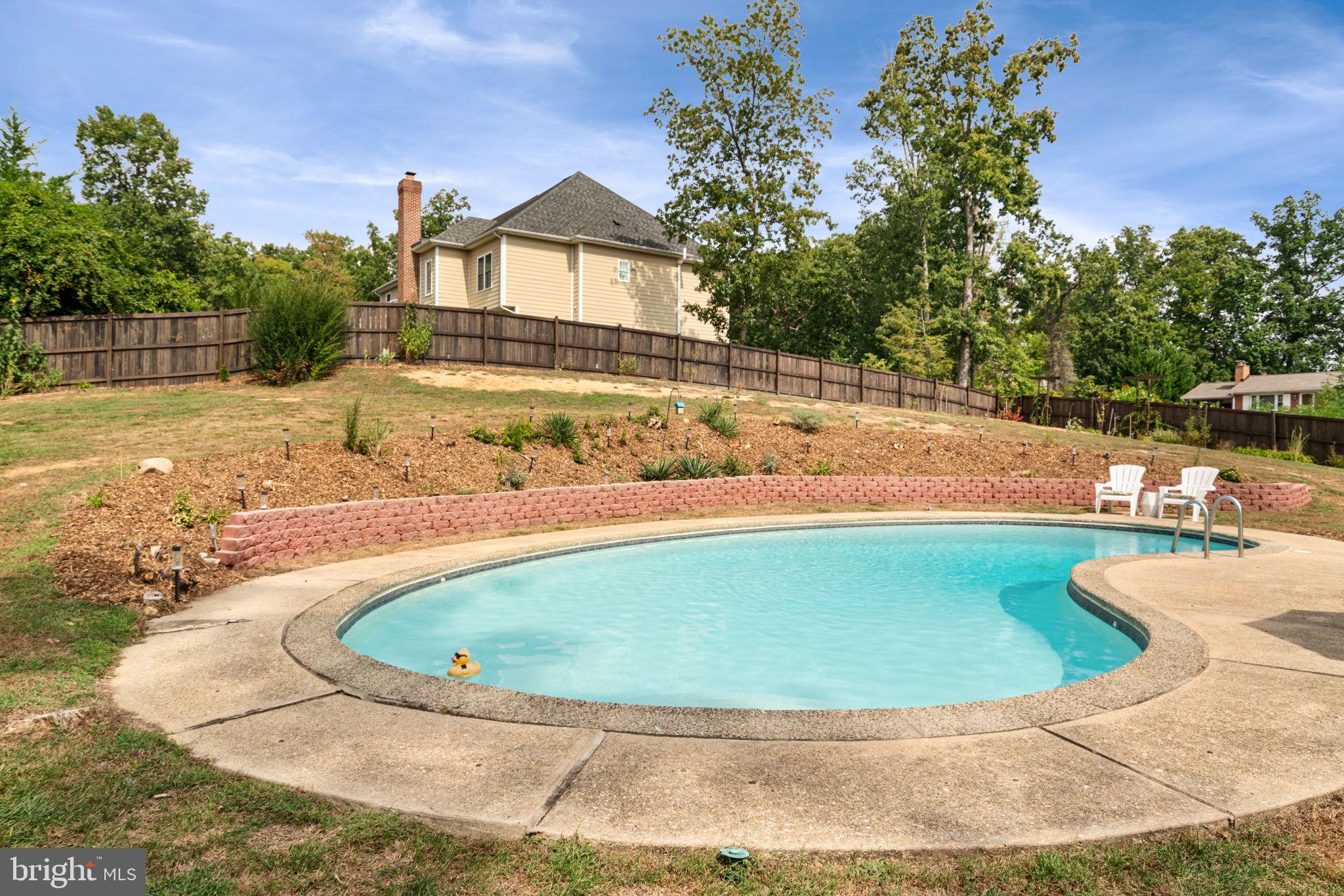 6700 Bulkley Road Lorton, VA 22079 - Photo 53 of 62 a view of a house with a yard