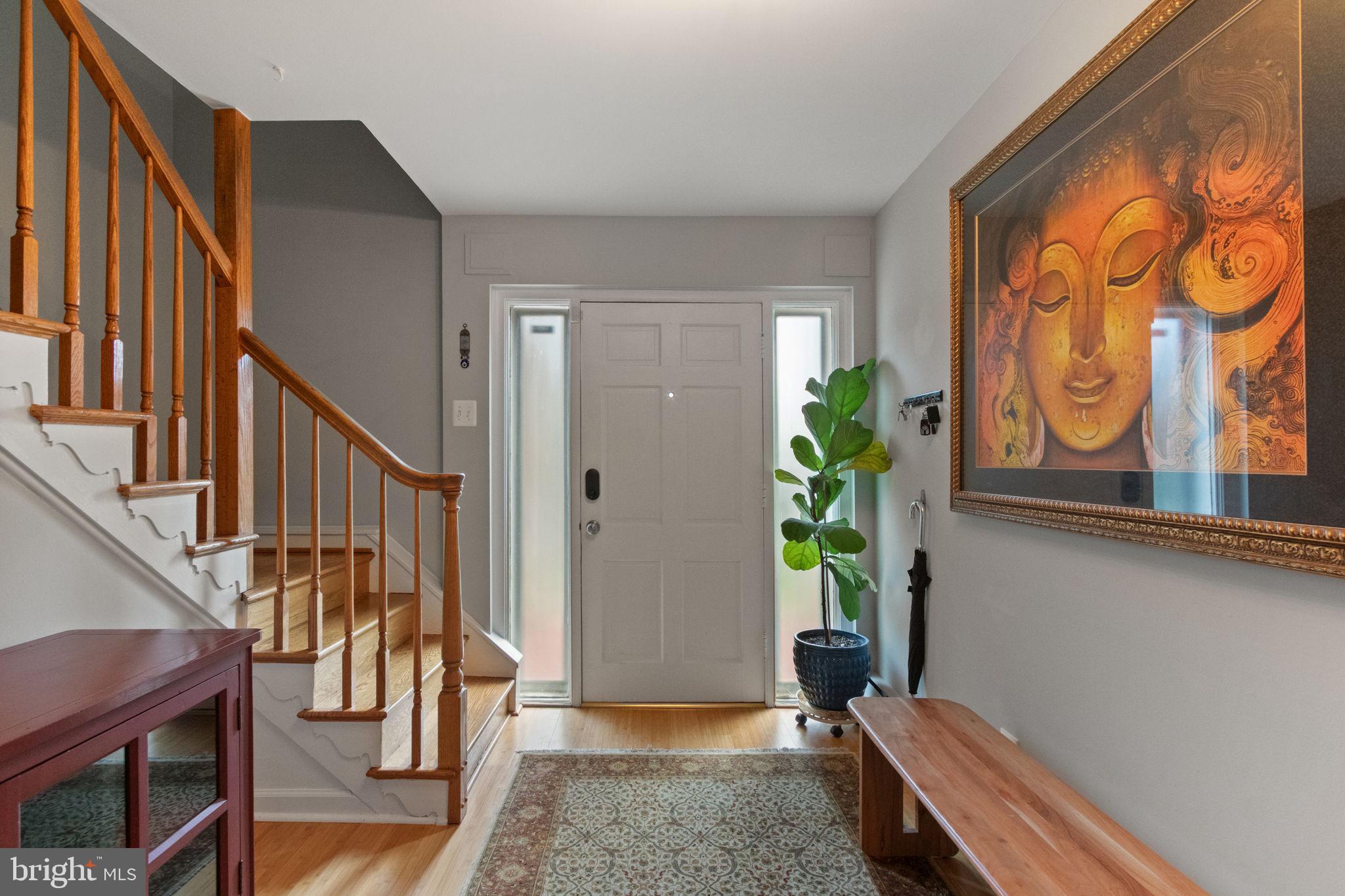 6700 Bulkley Road Lorton, VA 22079 - Photo 7 of 62 a living room with wooden floor and a potted plant
