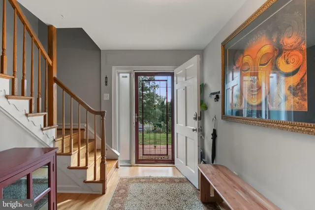a kitchen with stainless steel appliances granite countertop a refrigerator and a stove