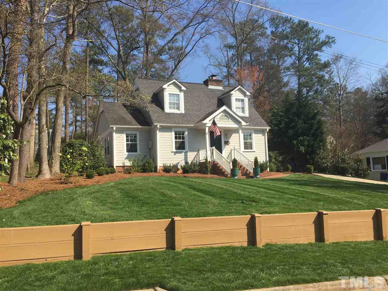 2807 Wayland Drive Raleigh, NC 27608 - Photo 1 of 24 a front view of a house with a yard