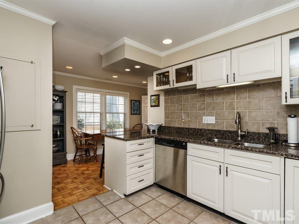 2807 Wayland Drive Raleigh, NC 27608 - Photo 12 of 24 a kitchen with granite countertop a sink and cabinets