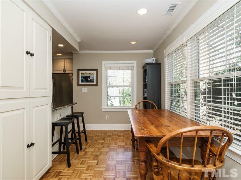2807 Wayland Drive Raleigh, NC 27608 - Photo 13 of 24 a view of a dining room with furniture and windows