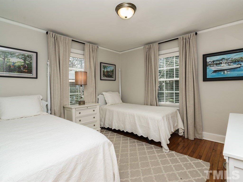 2807 Wayland Drive Raleigh, NC 27608 - Photo 14 of 24 a bedroom with double bed and a window