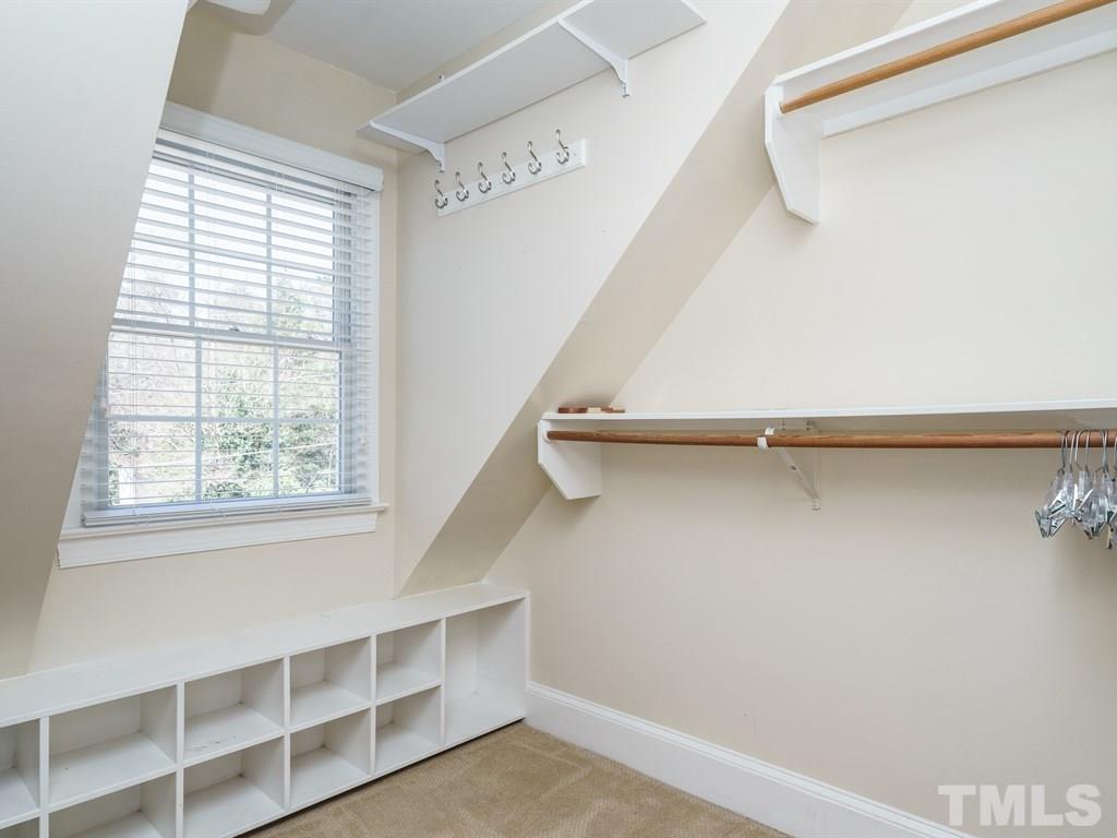 2807 Wayland Drive Raleigh, NC 27608 - Photo 17 of 24 a view of a room with rack on the wall and a window
