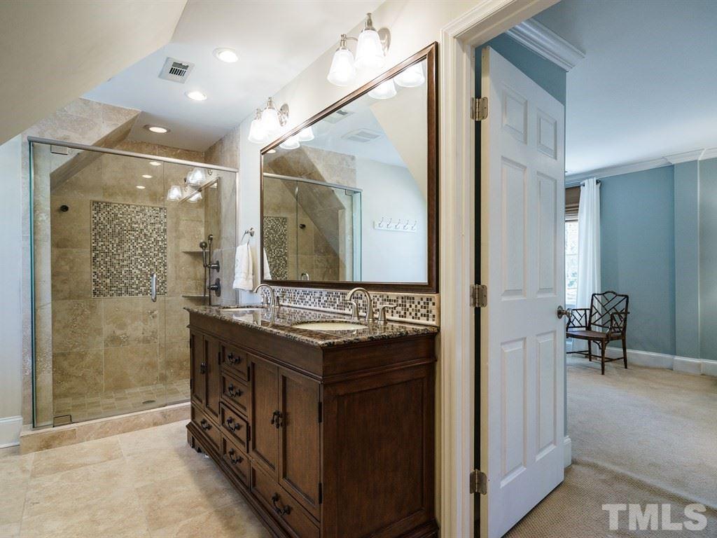 2807 Wayland Drive Raleigh, NC 27608 - Photo 18 of 24 a bathroom with a sink a mirror and a shower