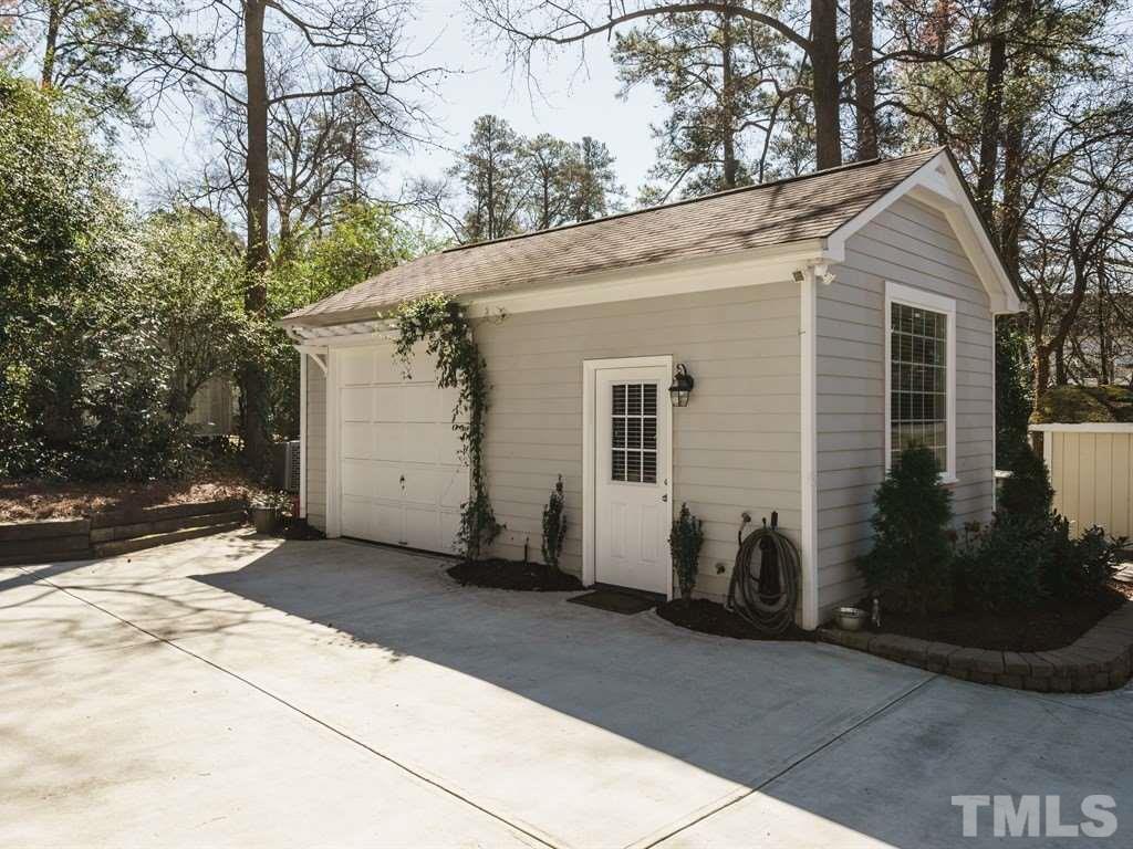 2807 Wayland Drive Raleigh, NC 27608 - Photo 22 of 24 a view of a white house with a yard