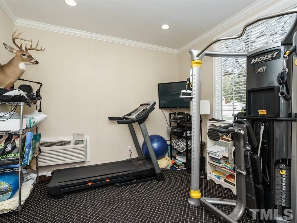 2807 Wayland Drive Raleigh, NC 27608 - Photo 23 of 24 a room with gym equipment