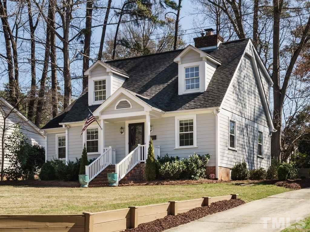 2807 Wayland Drive Raleigh, NC 27608 - Photo 4 of 24 a front view of a house with a yard