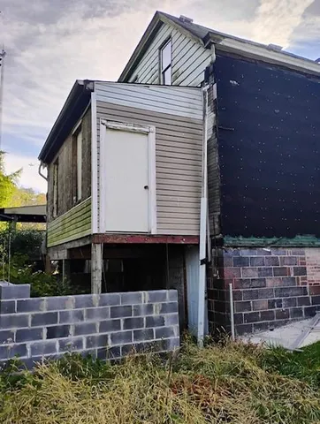 a front view of house with stairs