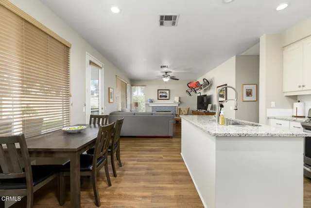a kitchen with granite countertop lots of counter top space and dining table