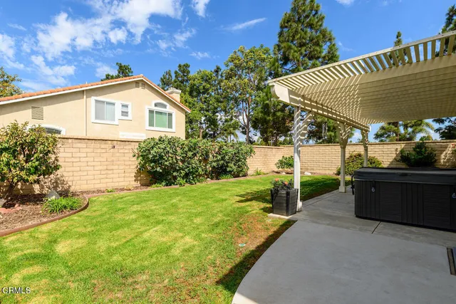 a view of a backyard with sitting area